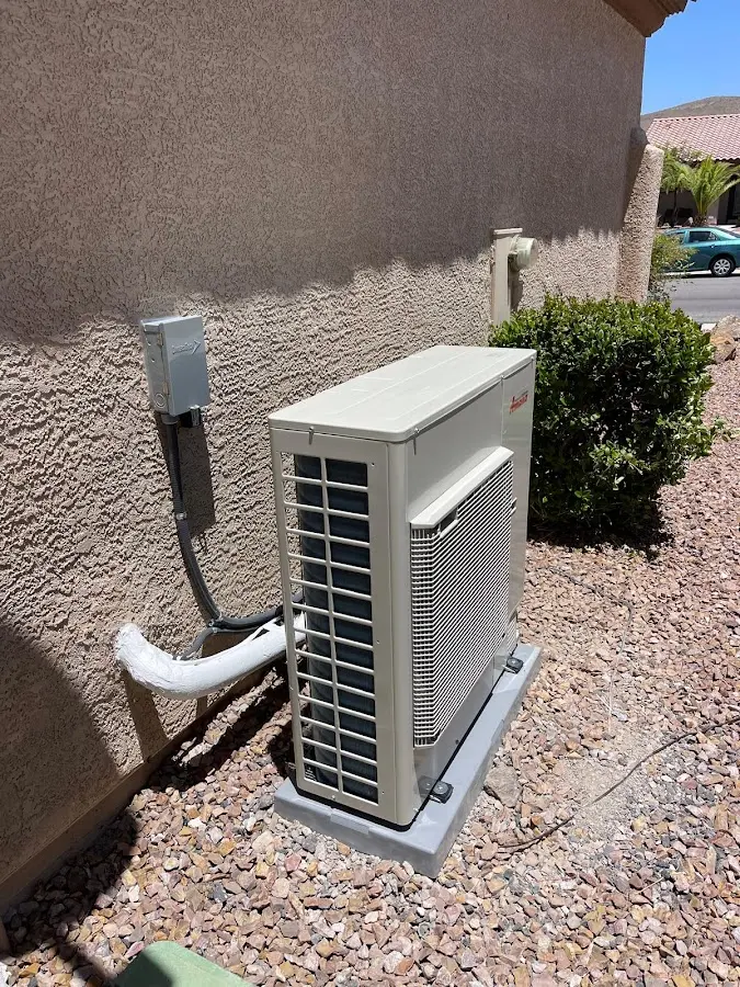 Residential air conditioning condenser unit in Sandy